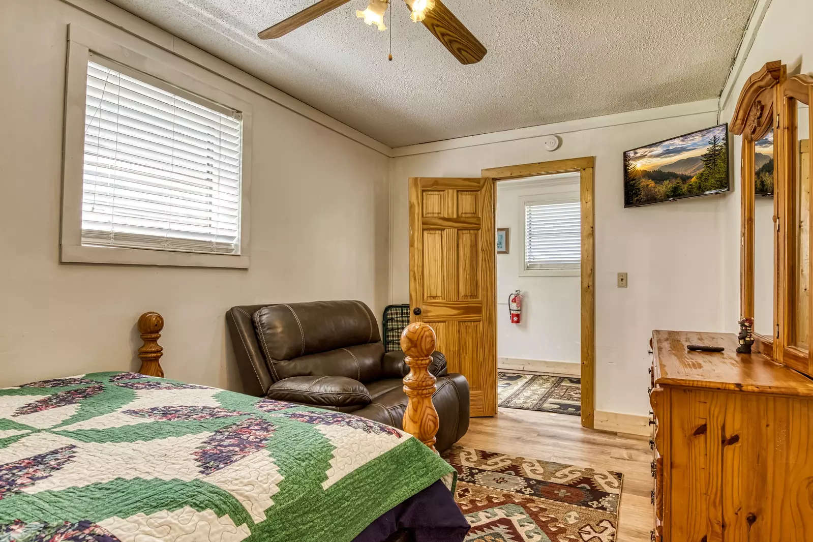 Happy Hollow Hideaway lower level bedroom with 32 inch TV and recliner