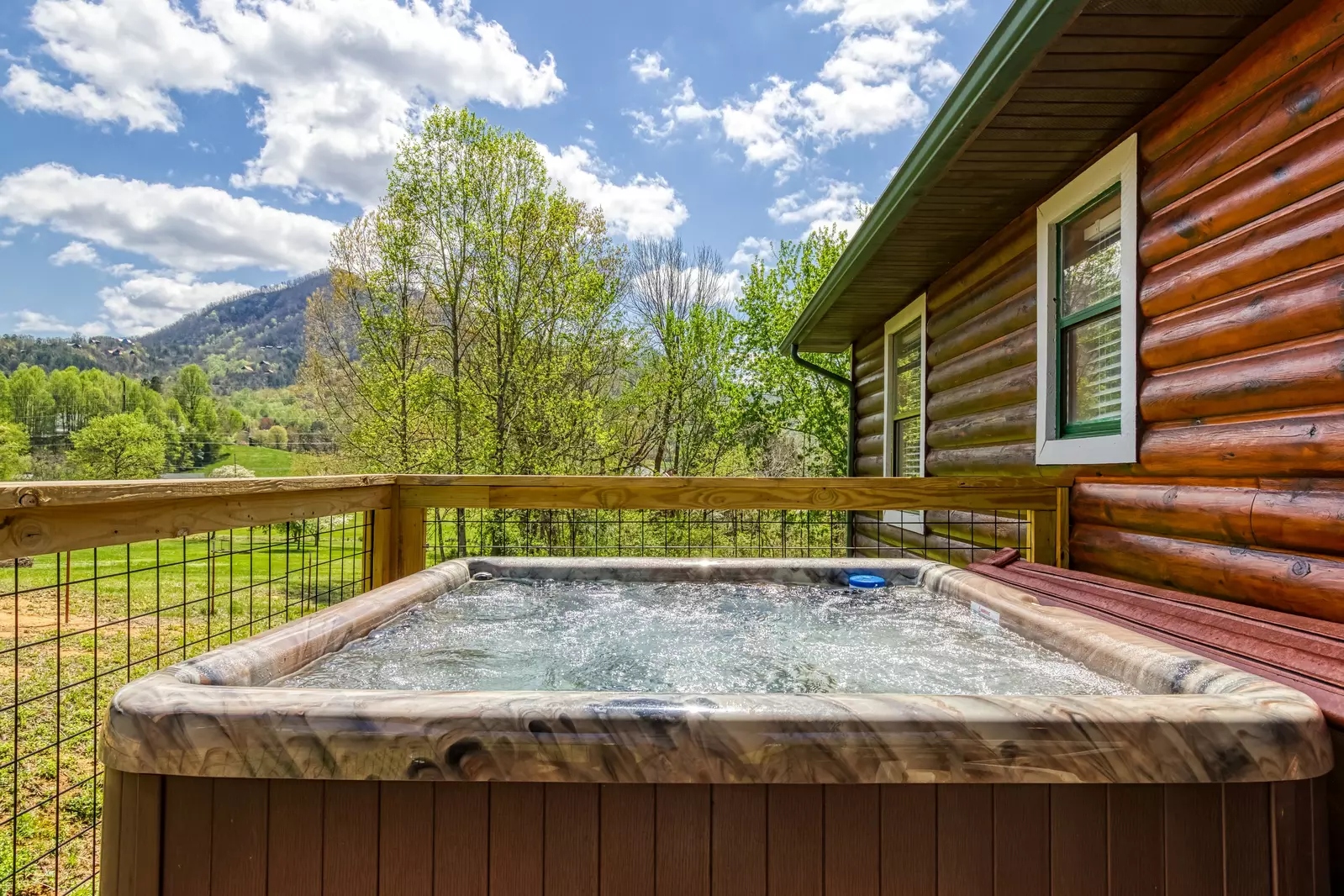 Happy Hollow Hideaway back deck with hot tub