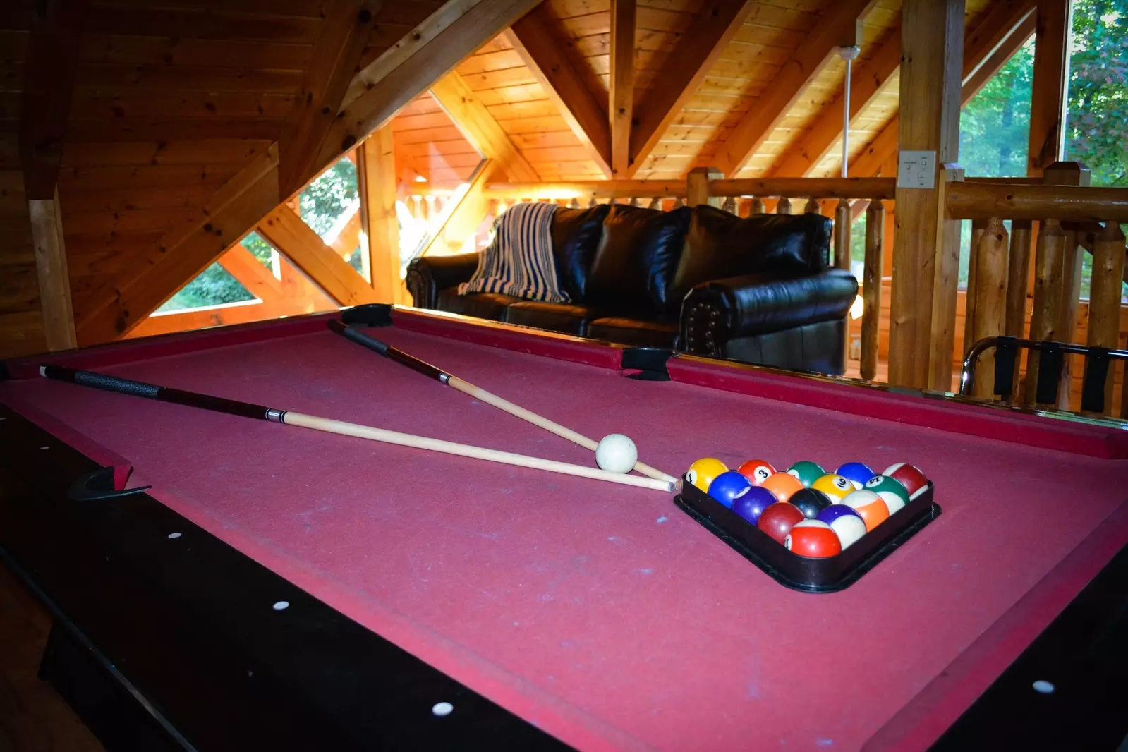 Loft game room with pool table and sleeper sofa