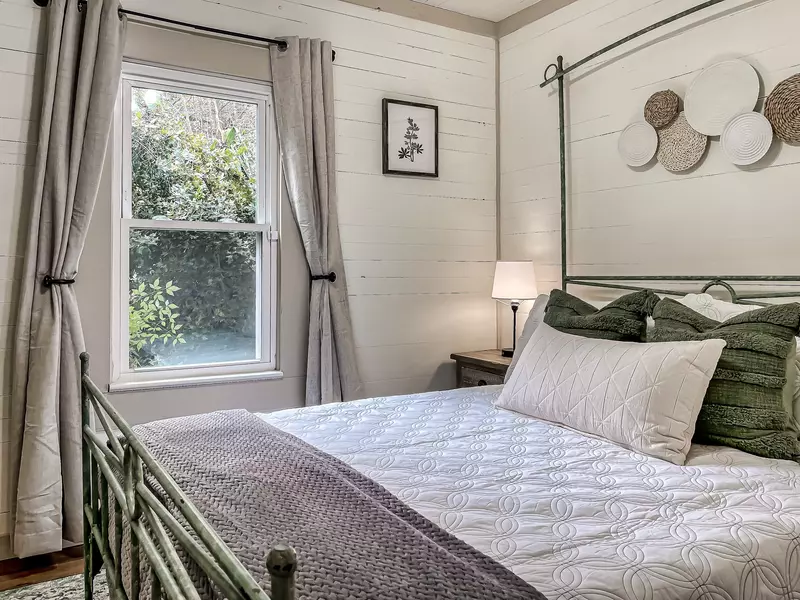 Guest bedroom with a queen size bed.