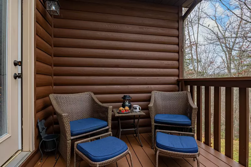 fenced patio with hot tub