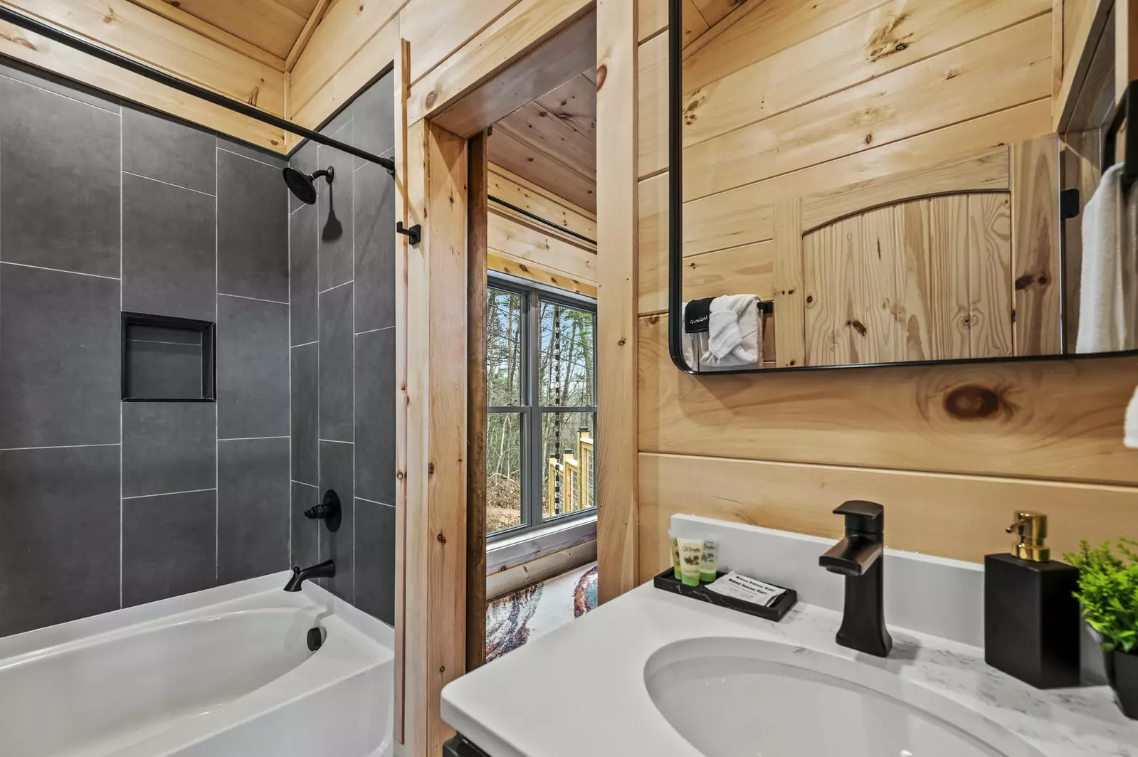 Indulge in luxury and unwind in the  common bathroom, featuring an elegant oval tub