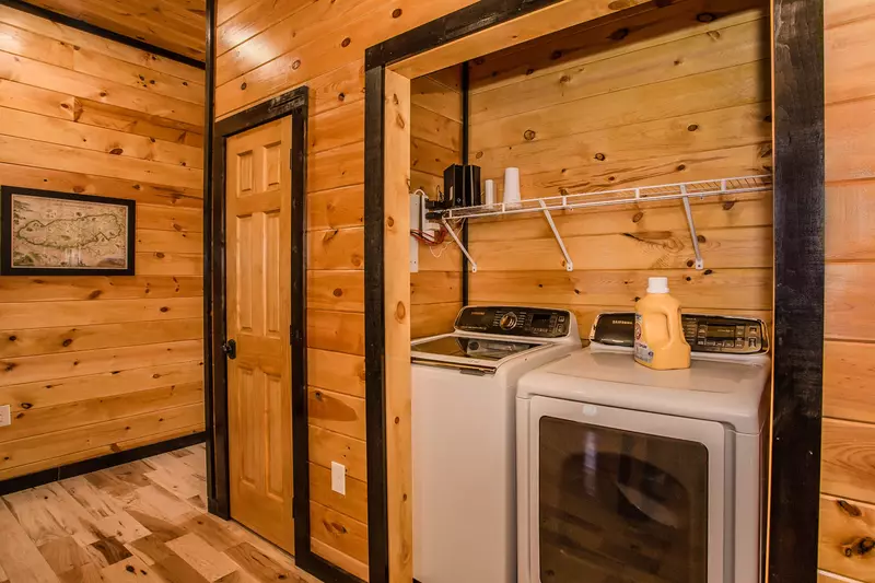Large capacity washer and dryer in lower hallway.