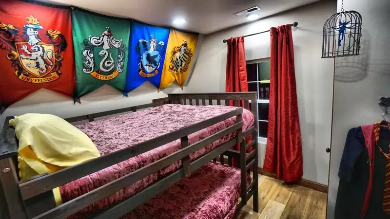  two velvet balloon chairs and a mirror wall
