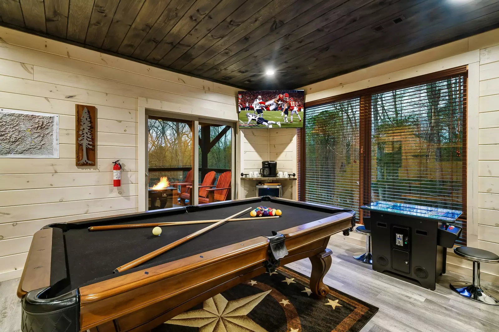 Game room has a pool table, 55" TV, and arcade games!