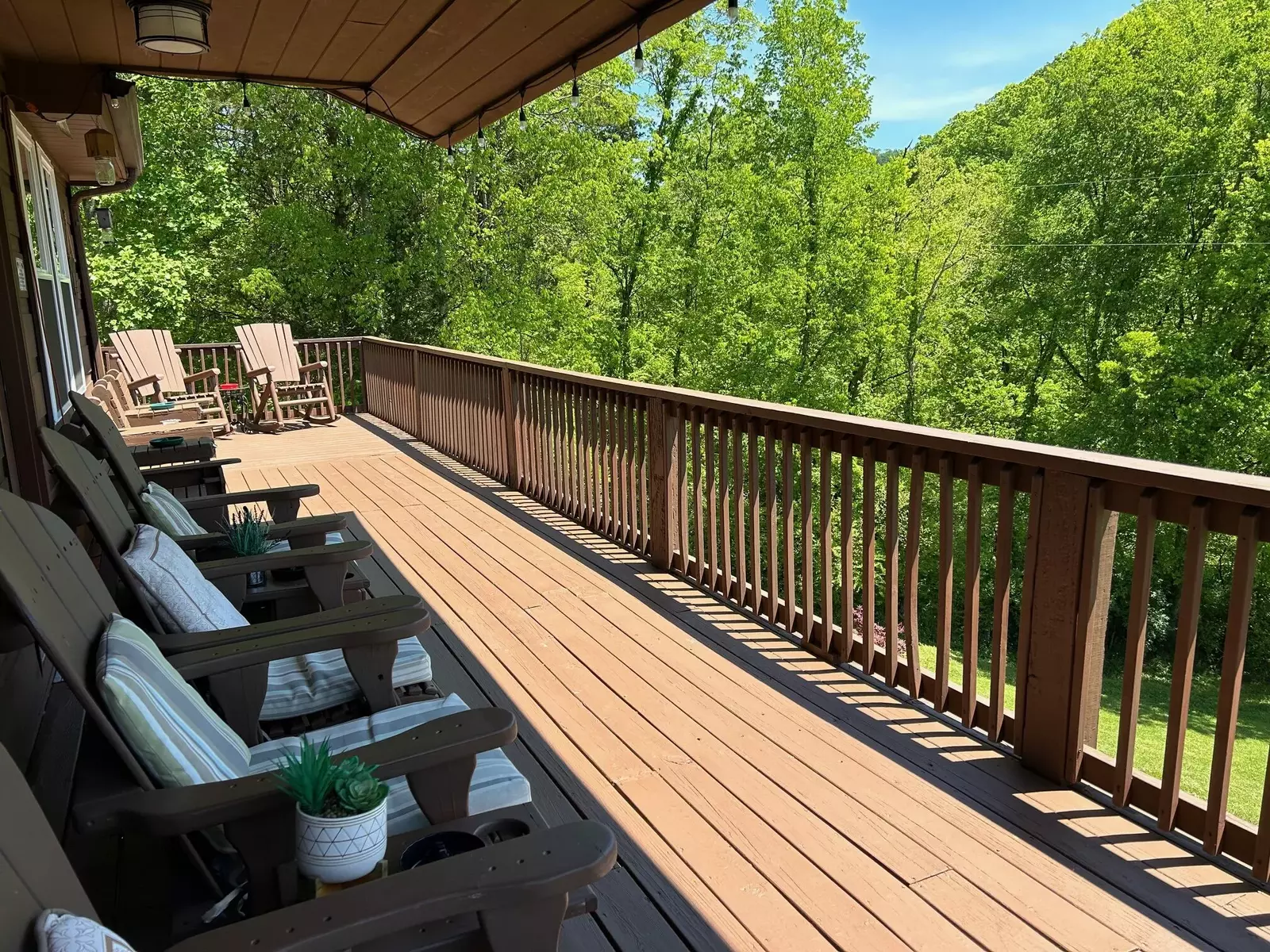 Large wraparound deck with dining and seating
