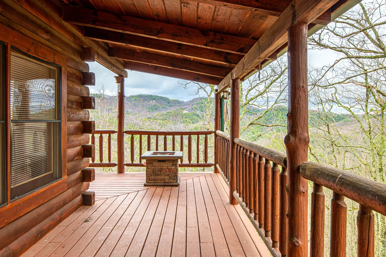 Main/entry level deck - right side of cabin - propane fire pit
