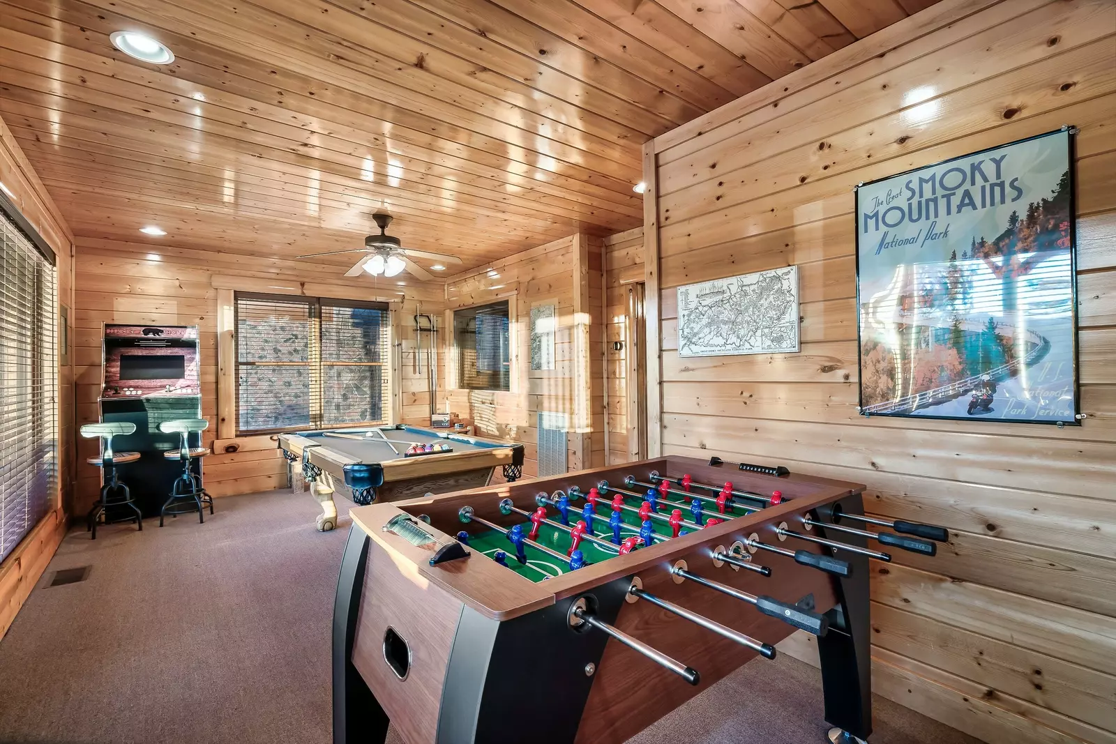 Game room with foosball and pool table and arcade