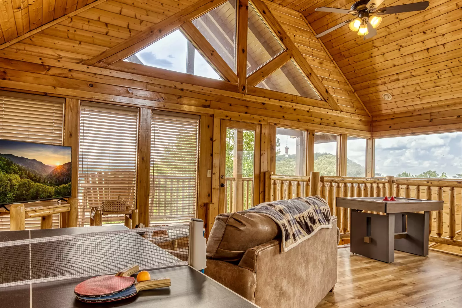 Awesome Views upper level loft area with ping pong table, sitting area, and air hockey table