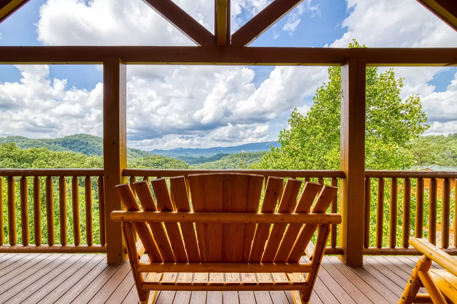 Awesome Views upper level deck with loveseat rocking chair with mountain views