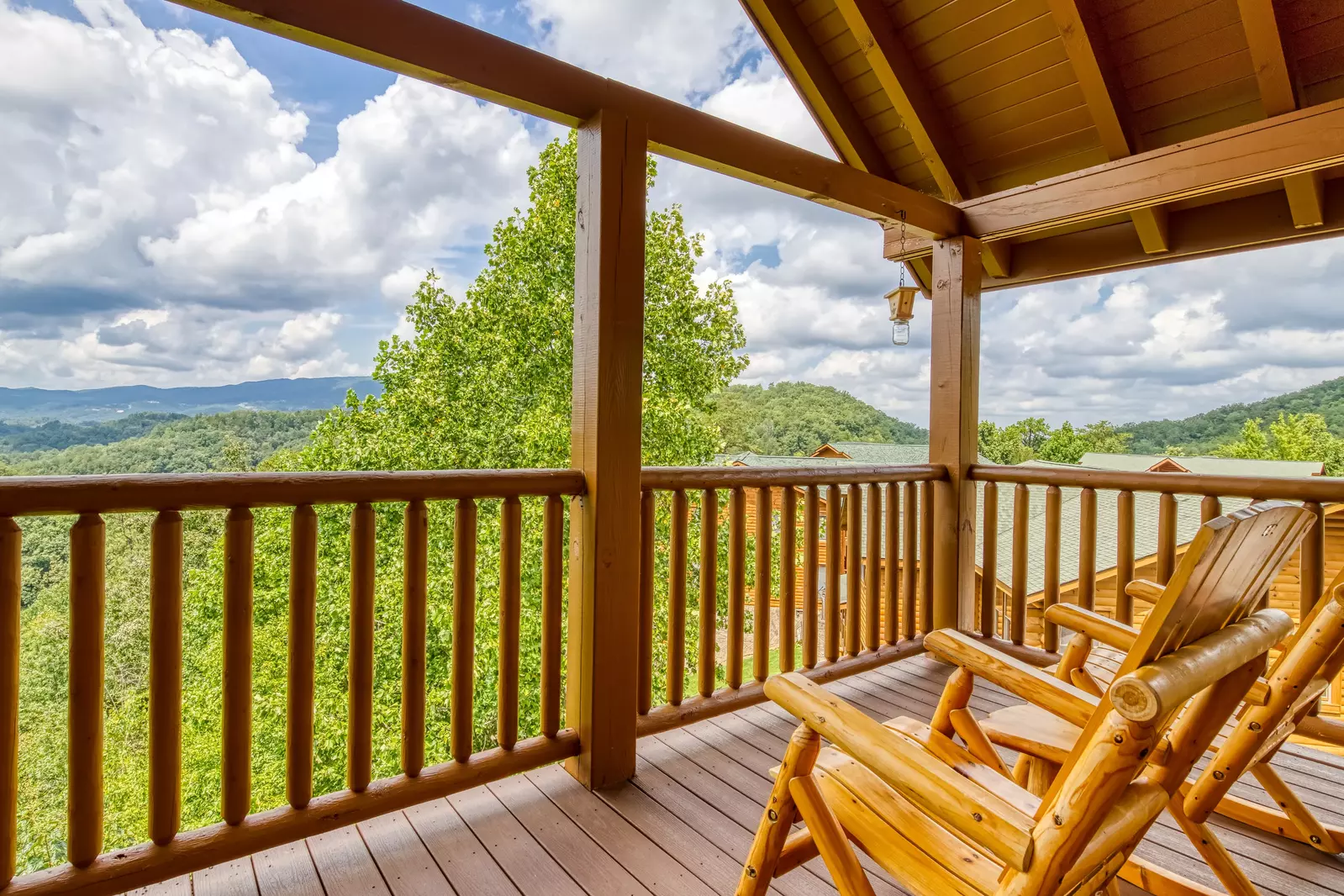 Awesome Views upper level deck with rocking chairs and mountain views