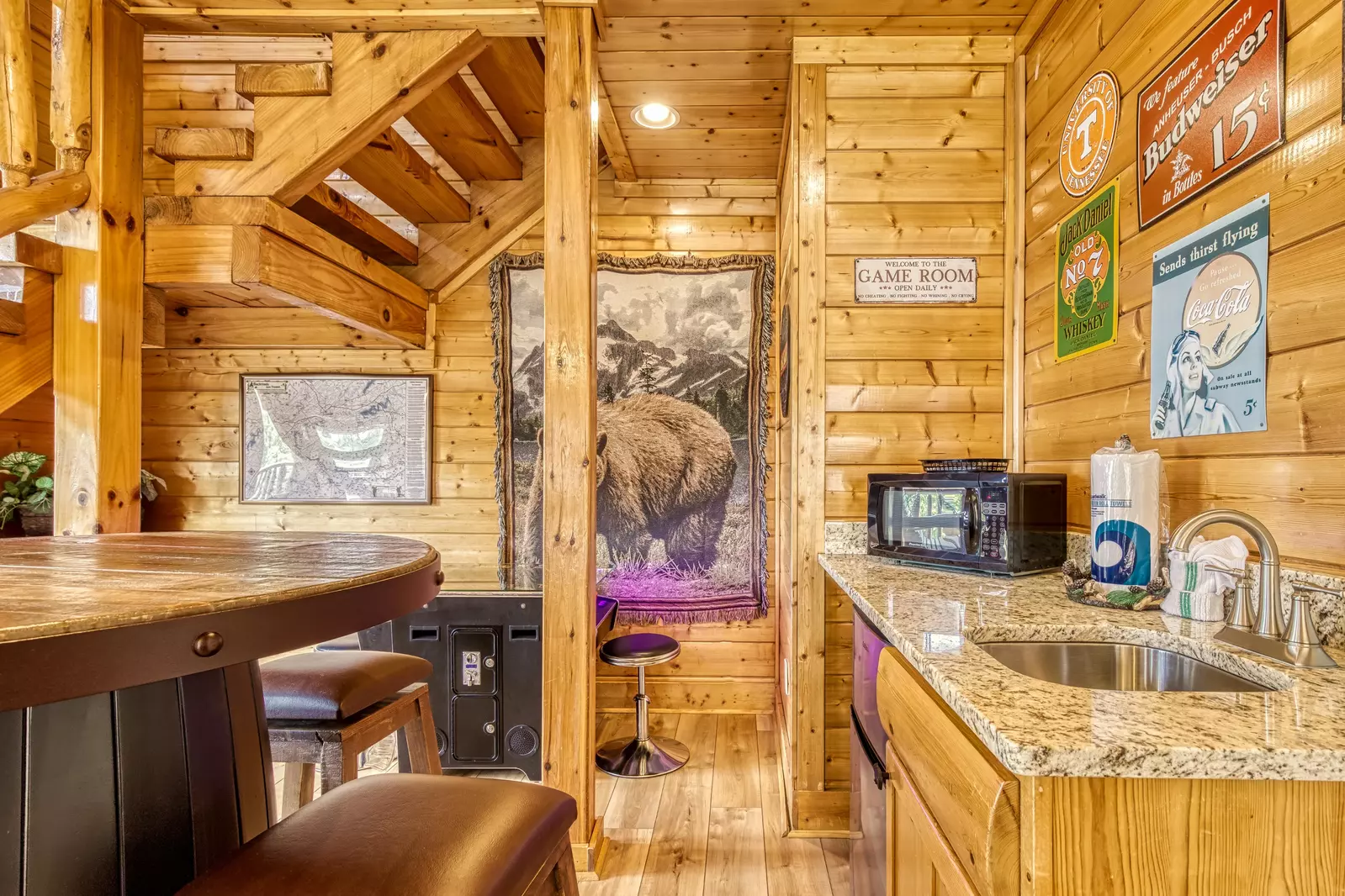 Awesome Views kitchen lower level game room with kitchenette and cocktail style arcade game