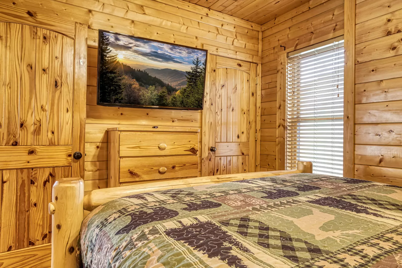 Awesome Views lower level bedroom with queen size bed and 48 inch TV