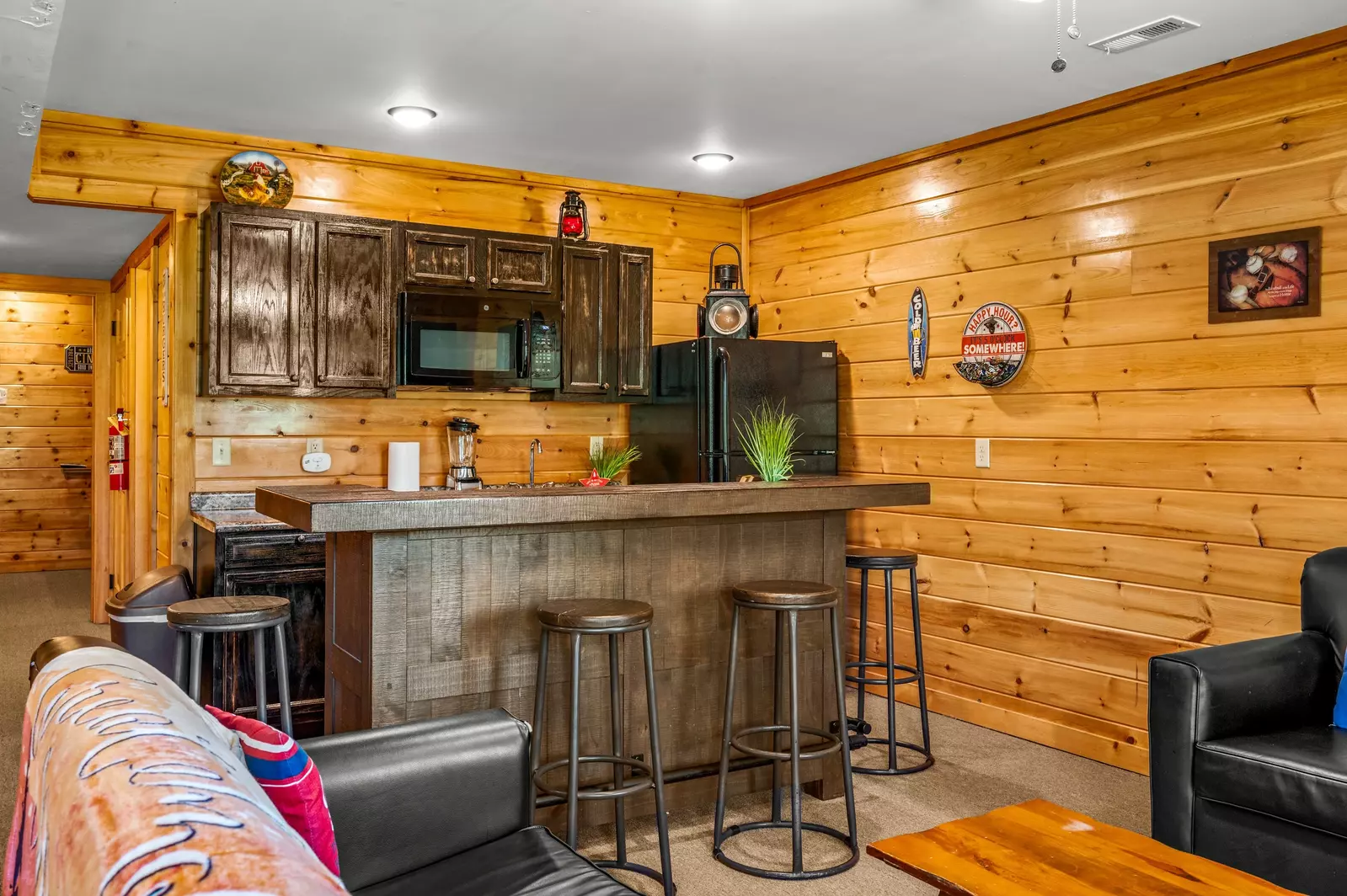 Nothin’ But a Good Time – a spacious 4-bedroom Smoky Mountain cabin rental in Sevierville featuring king bedrooms, twin bunks, hot tub, theater room, fire pit, and cozy mountain views.