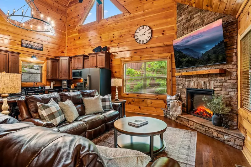 Open concept living room with large TV