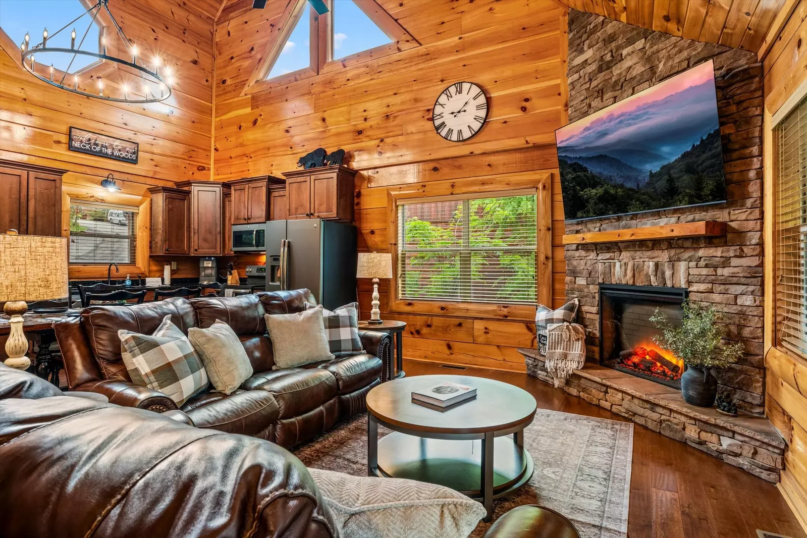 Open concept living room with large TV